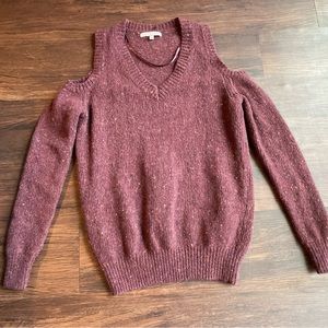 Purple Rebecca Minkoff sweater.